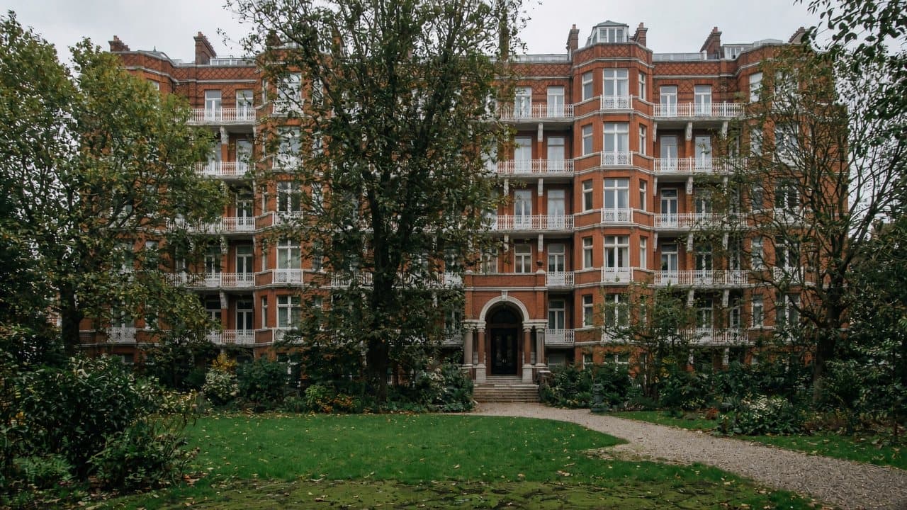Red-brick and terracotta mansion block with a quiet garden court, typical of Maida Vale, W9